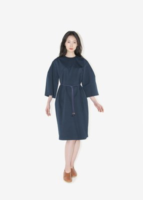 46. Twill-weave organic cotton dress with hemp braided cord beltDress constructed with a minimal composition of planes. The belt is made from natural hemp thread. Braided in a Japanese traditional braiding technique called karauchi.