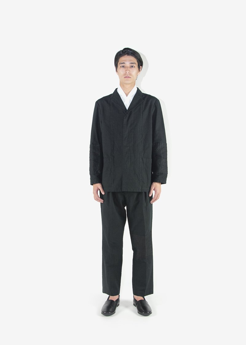 31. Hemp work jacket and slacksHand-woven hemp fabric patchwork and sashiko hand-embroidery on the elbows and the knees. Worn with naturally tanned leather shoes.