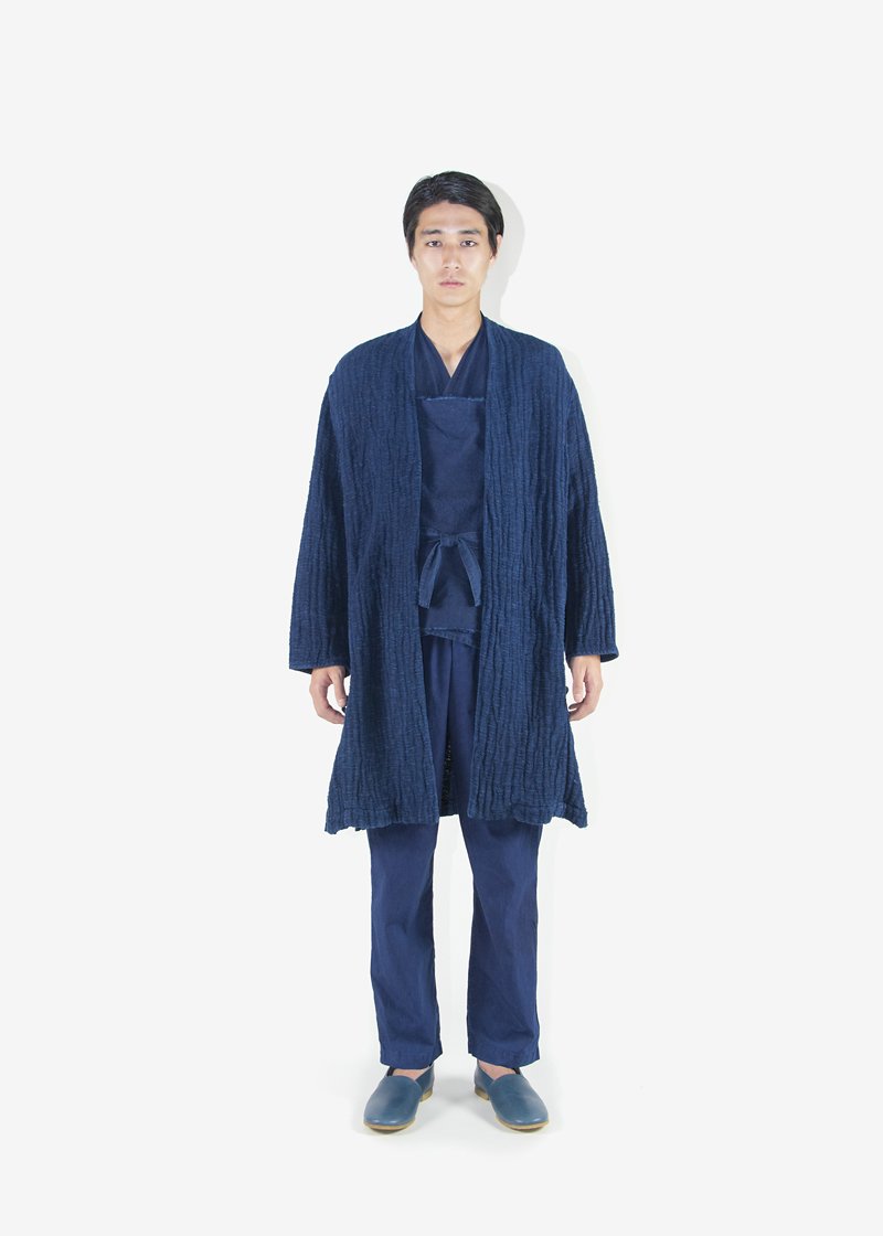 63. Hemp work coat, hemp work top with Hakkaku-Shinka embroidery, organic cotton wrapped pants - Ryukyu indigoThe deep oceanic blue of Ryukyu indigo is produced by a skilled dyer in Kyoto. Worn with naturally tanned leather shoes.