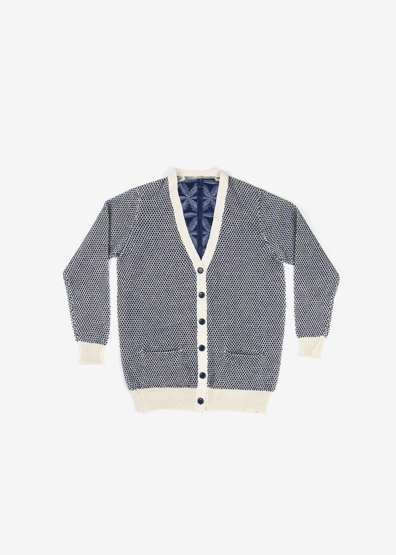 73. Flower of Life Kurume-kasuri cardigan - natural indigoHand-loomed Kurume-kasuri textile with symbolic Flower of Life motif. The Kasuri is made from organic cotton. Composed with hemp knitting. Comes in natural indigo, gray and beige.