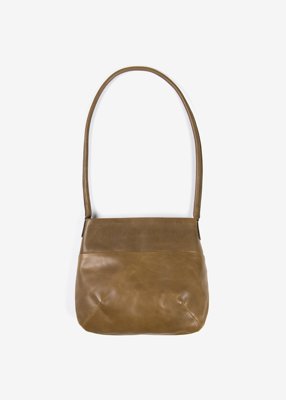 77. Naturally tanned leather shoulder bag - brownSmooth textured leather tanned with the extract from bark of mimosa tree. No hazardous chemicals, artificial coloring or treatments are used throughout the production process.