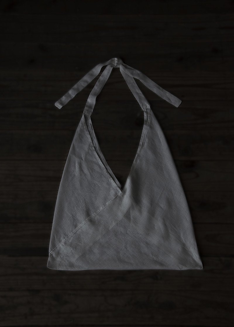 08. Organic linen TsunobukuroTsunobukuro-bag made from a single folded piece of finest linen fabric. The fabric is woven slowly with a shuttle weaving machine.