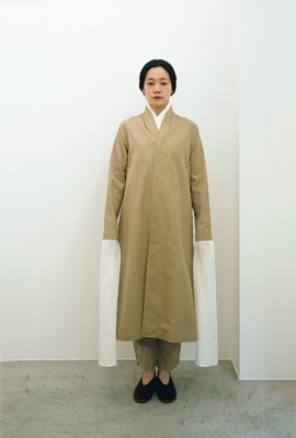 15. Collarless trench coat and Organic cotton wrapped pantsA collarless trench coat made from extra-long staple superior pima-cotton.