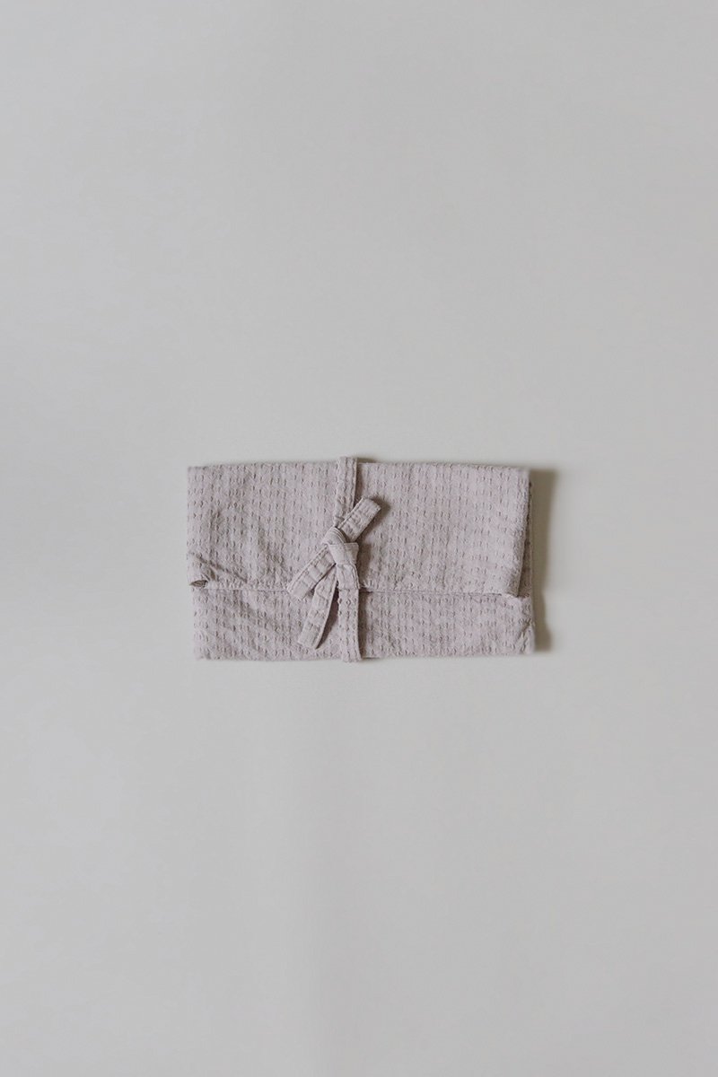 19. Sashiko clutch bagFabric woven with sashiko techniques using shuttle weaving machine. Fabric is composed of organic cotton for the warp, and alternate layers of hemp threads and organic cotton for the woof. Sashiko stitches are cross woven with twisted hemp threads.