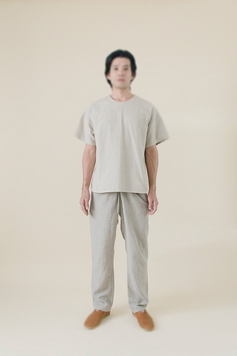 43. Sashiko shirt, Linen wrapped pantsFabric woven with sashiko techniques using shuttle weaving machine. Fabric is composed of organic cotton for the warp, and alternate layers of hemp threads and organic cotton for the woof. Sashiko stitches are cross woven with twisted hemp threads. Wrapped pants made from fine belgian linen fabric.