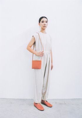 Organic cotton overalls and Naturally tanned leather shoulder pouch