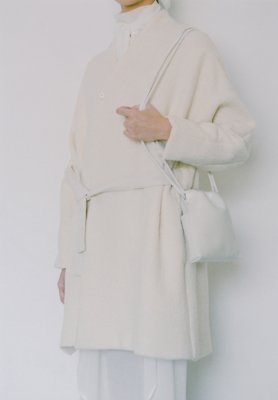 Light leather light beige colored drawstring bag