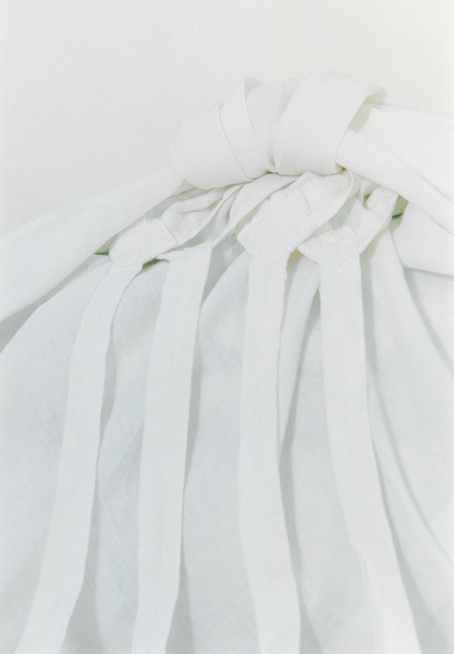 Organic Belgian linen white colored furoshiki for wrapping bedding and clothing from “Ryugu”, a new concept home collection