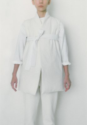 White colored folk down vest made of brushed wool