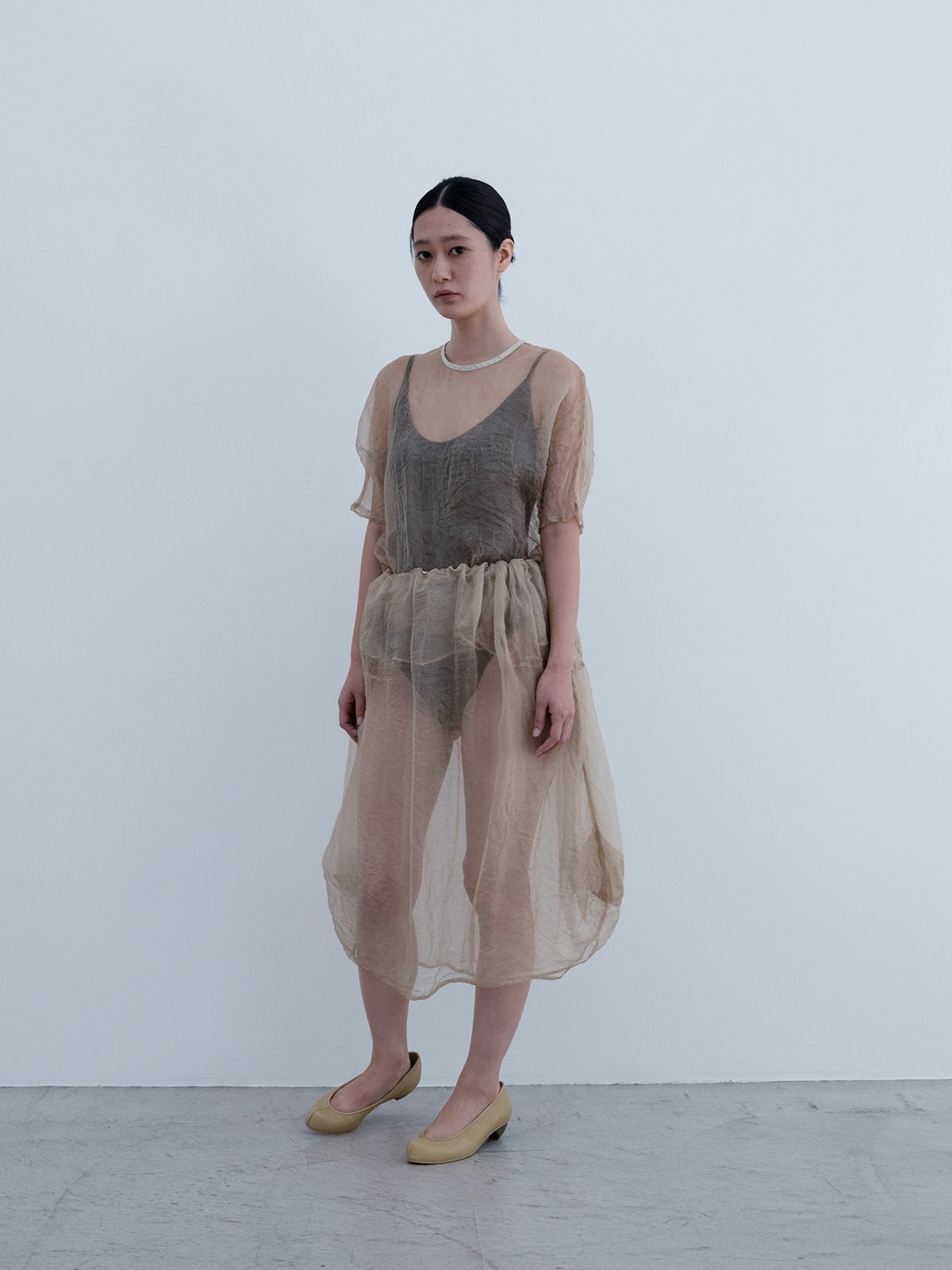 Beewax colored silk organdie dolman sleeve pullover and drawstring bag skirt, Mud-dyed nirvana soil colored leotard, Deerskin “koshin” folk pumps