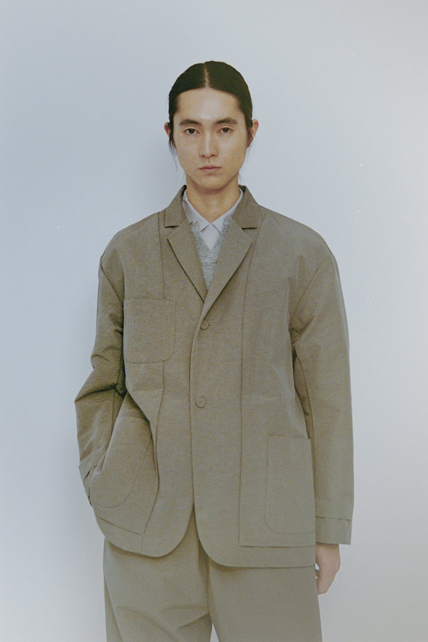 Unique reversible jacket with tailored collar folded inside. Made of cotton-nylon linen ramie.