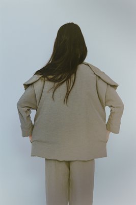 Right side is made of cotton nylon linen ramie. Lining is a golden ratio made of 90% down and 10% feather.