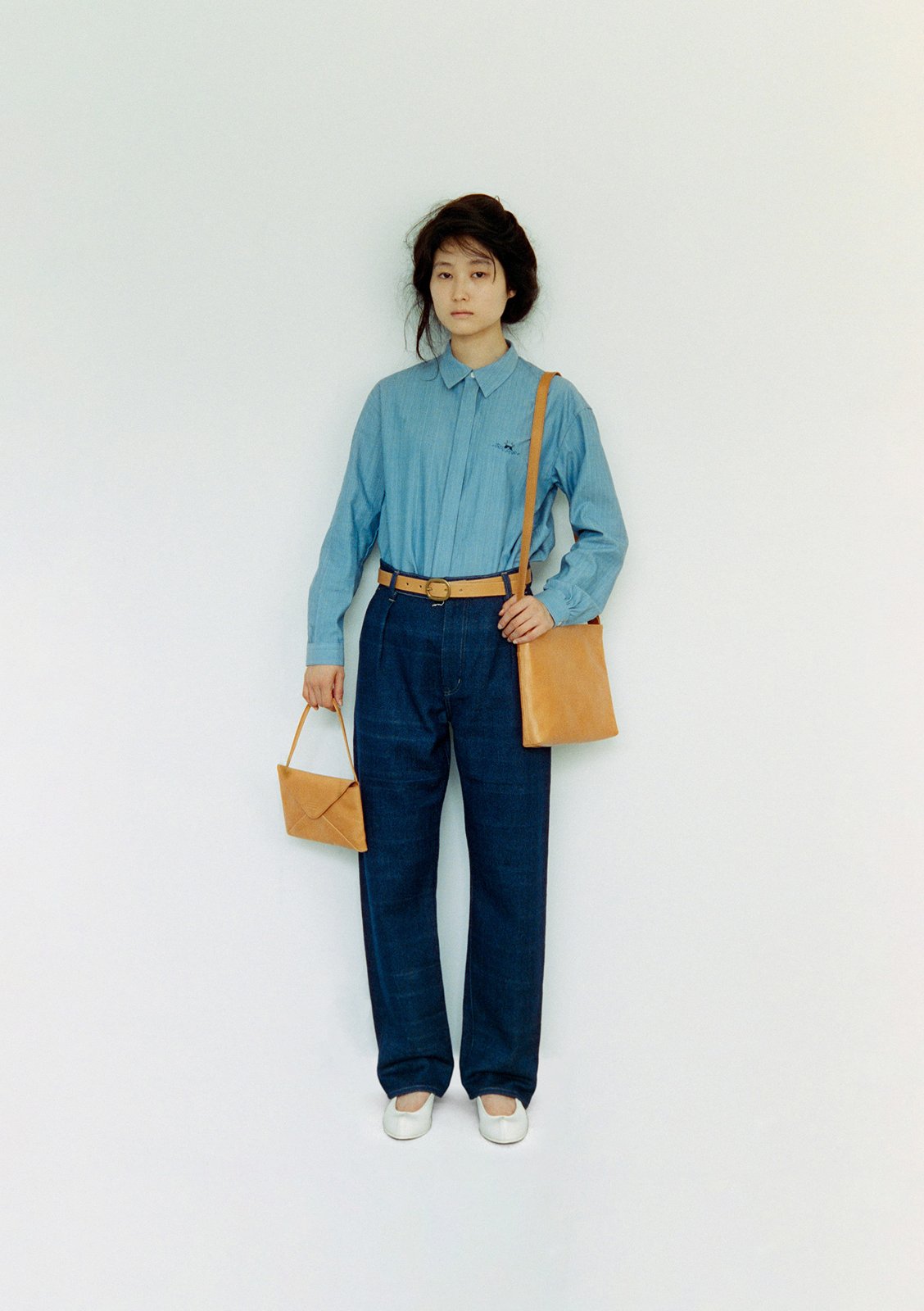 Organic cotton ryugu crest embroidery shirt, Natural indigo-dyed hand-woven organic kara cotton denim pants, Naturally-tanned leather belt and envelope purse